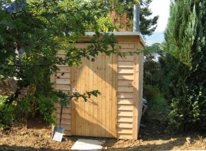 Exterior of compost toilet timber building in Llandinam, Wales